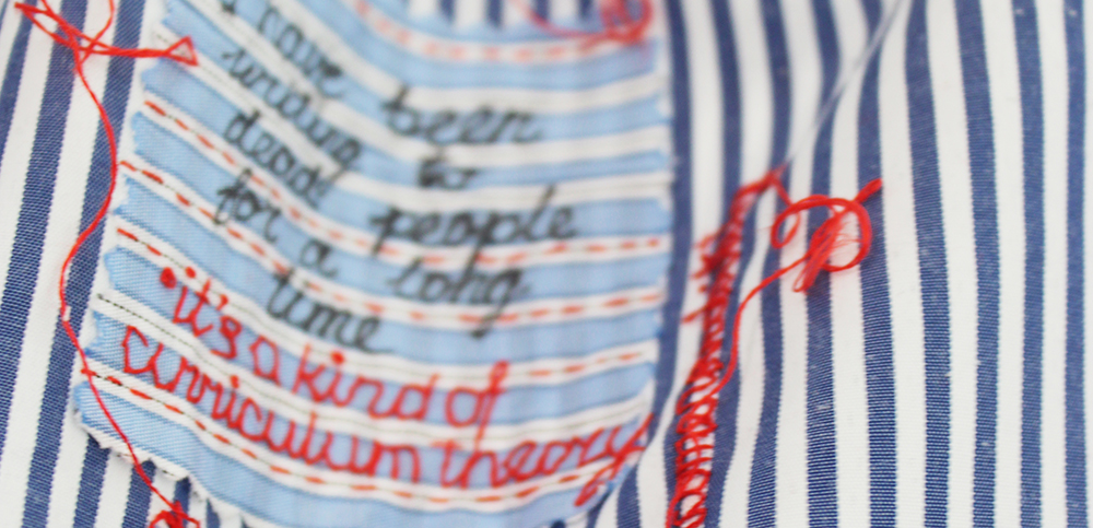 embroidery project by Tatiana Zakharova-Goodman; a shirt which includes embroidered notes from 2026 CSSE (Canadian Society for the Study of Education) Conference; detail; embroidered text reads: it's a kind of curriculum theory