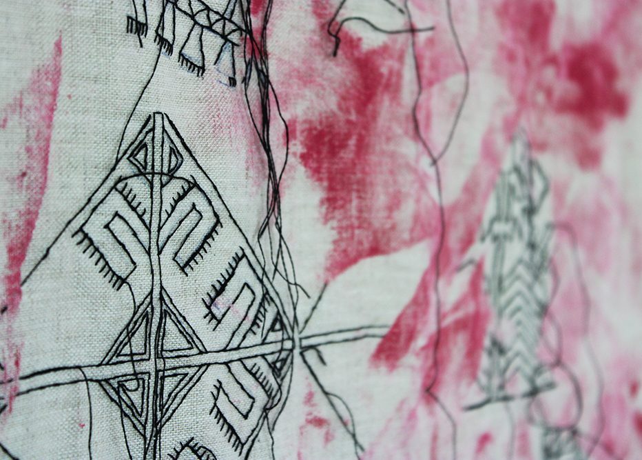 embroidery (detail) by Tatiana Zakharova-Goodman; a large canvas featuring black embroidery of Chuvashian motives over paint