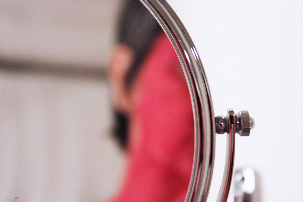 photograph; part of self-portrait project; painting oneself with red paint