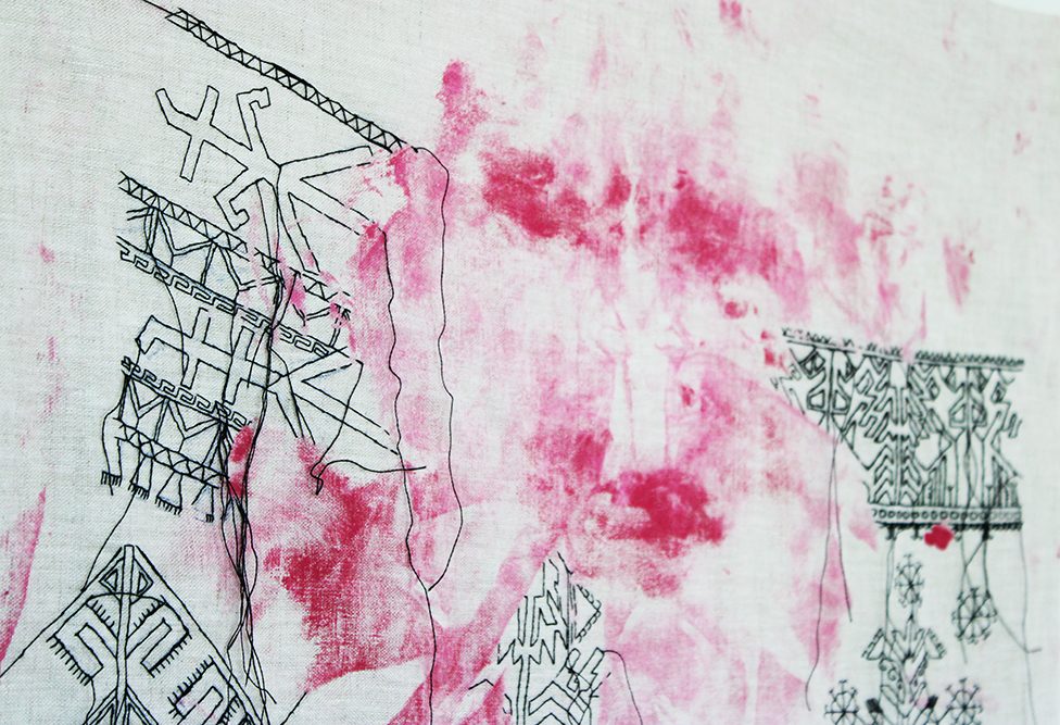 embroidery (detail) by Tatiana Zakharova-Goodman; a large canvas featuring black embroidery of Chuvashian motives over paint